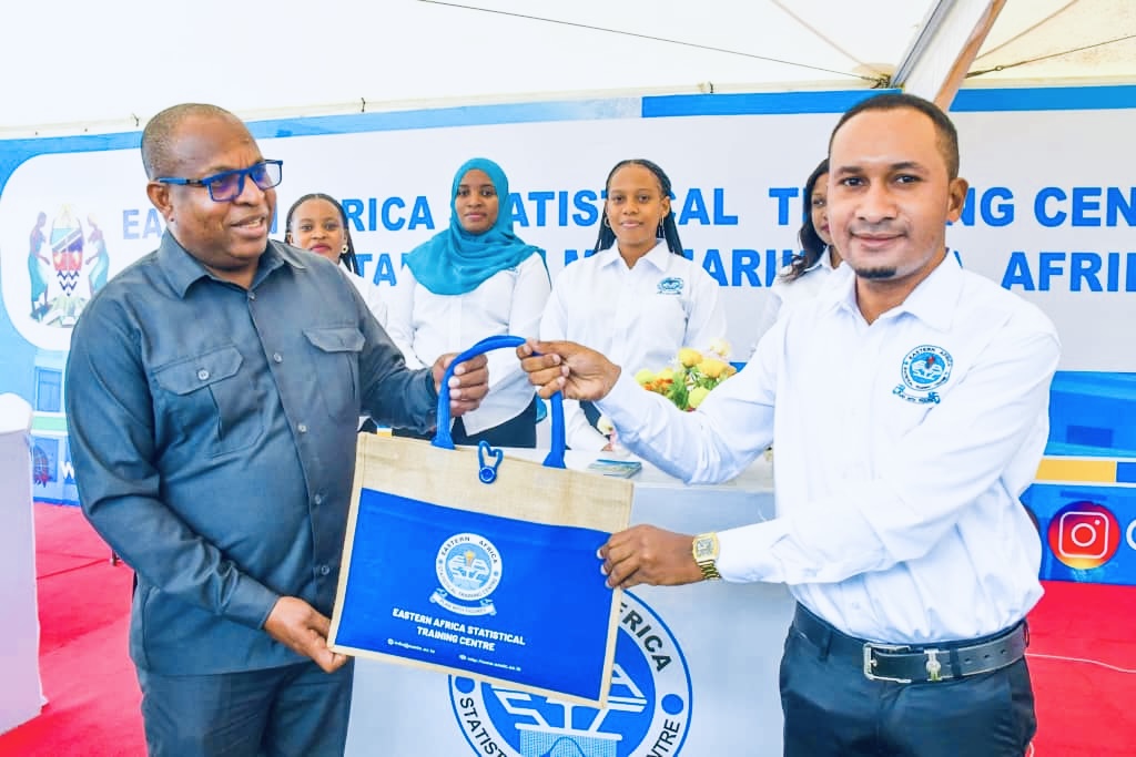 <p>EASTC Head of Communication and Marketing Unit Mr. Samuel Marandu presenting a gift to Mr. Khamis A. Said, Permanent Secretary, Ministry of Education and Vocational Training Zanzibar, when visited the booth of EASTC during the 6th Higher Education Exhibition in Zanzibar on July 24, 2025, held at Gombani Chake Chake, Pemba.</p>