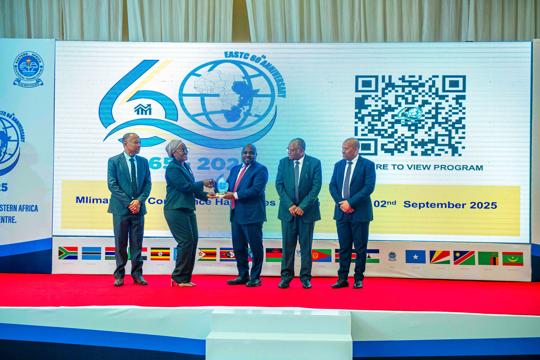 <p>Guest of honor Mr. Elijah Mwandumbya -Deputy Permanent Secretary, Ministry of Finance receiving award from EASTC during the 60 years anniversary celebrations at Mlimani City Conference Centre on 2nd September,2025.</p>